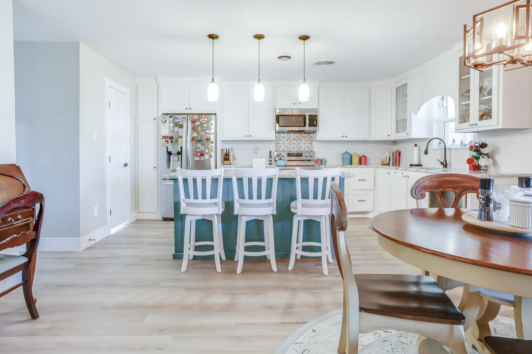 4306 57th Street Lubbock, TX 79413 - Photo 10 of 23 a dining room with furniture and wooden floor