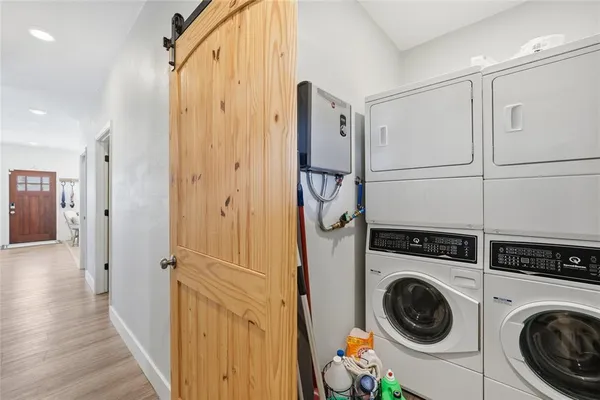 a view of a hallway with washer and dryer
