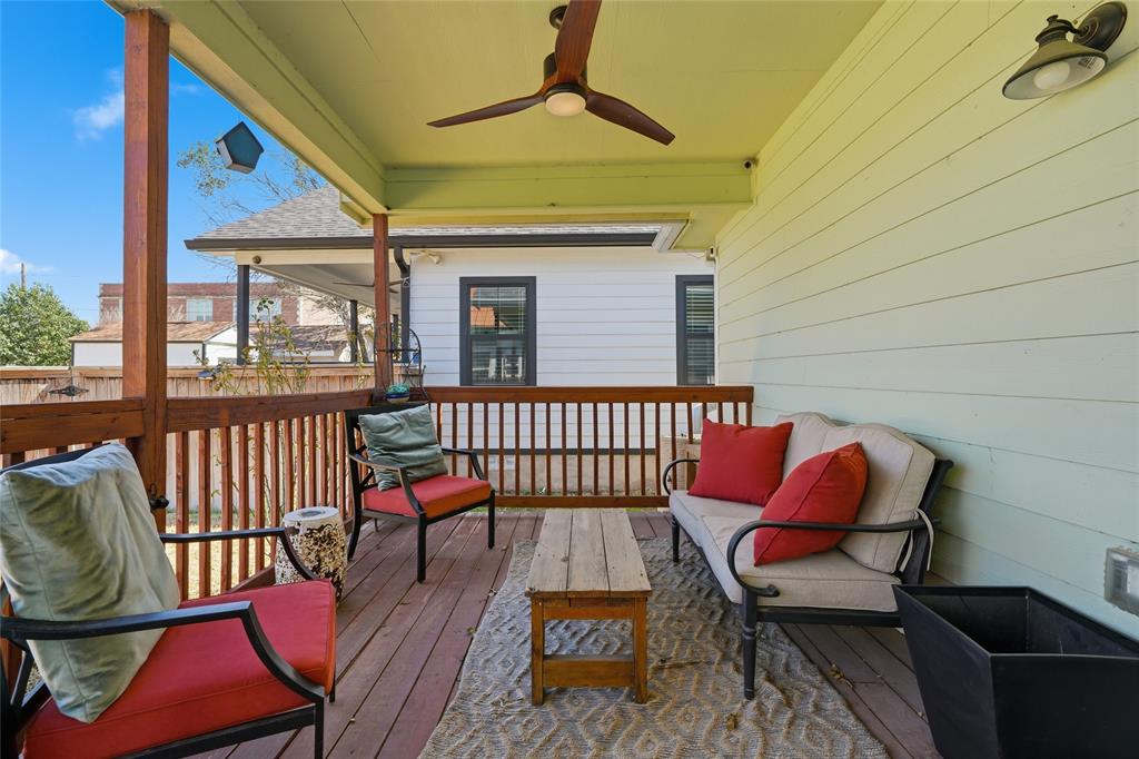 708 South 9th Street Waco, TX 76706 - Photo 20 of 26 a balcony with wooden floor and outdoor seating