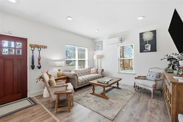 a living room with furniture and a window