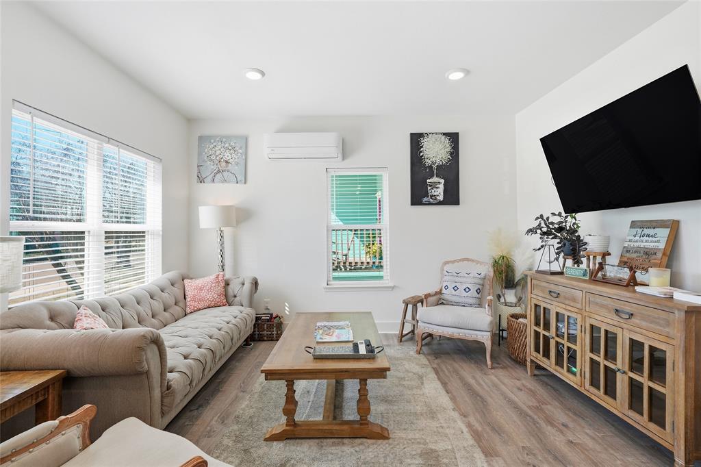 708 South 9th Street Waco, TX 76706 - Photo 6 of 26 a living room with furniture a flat screen tv and a window