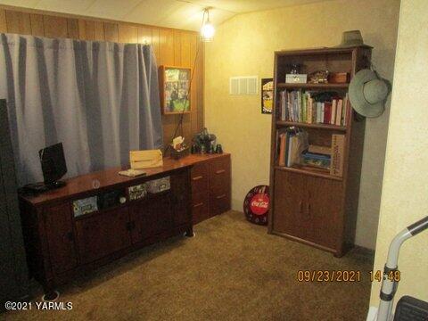 861 Hinman Road Harrah, WA 98933 - Photo 11 of 23 a bedroom with a bed and cabinets