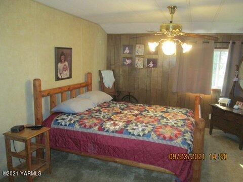 861 Hinman Road Harrah, WA 98933 - Photo 13 of 23 a bedroom with a bed window and furniture
