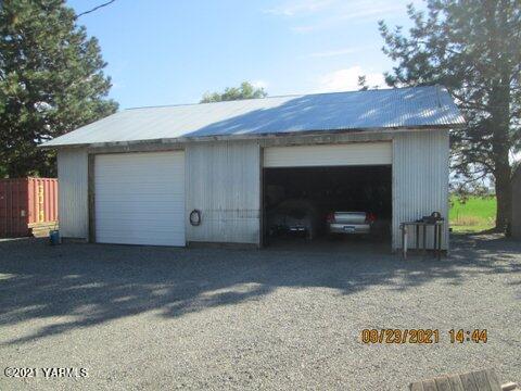 861 Hinman Road Harrah, WA 98933 - Photo 20 of 23 a view of house and car parked in yard