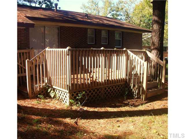 2909 Rannock Court Raleigh, NC 27604 - Photo 4 of 4 a side view of a house with a yard