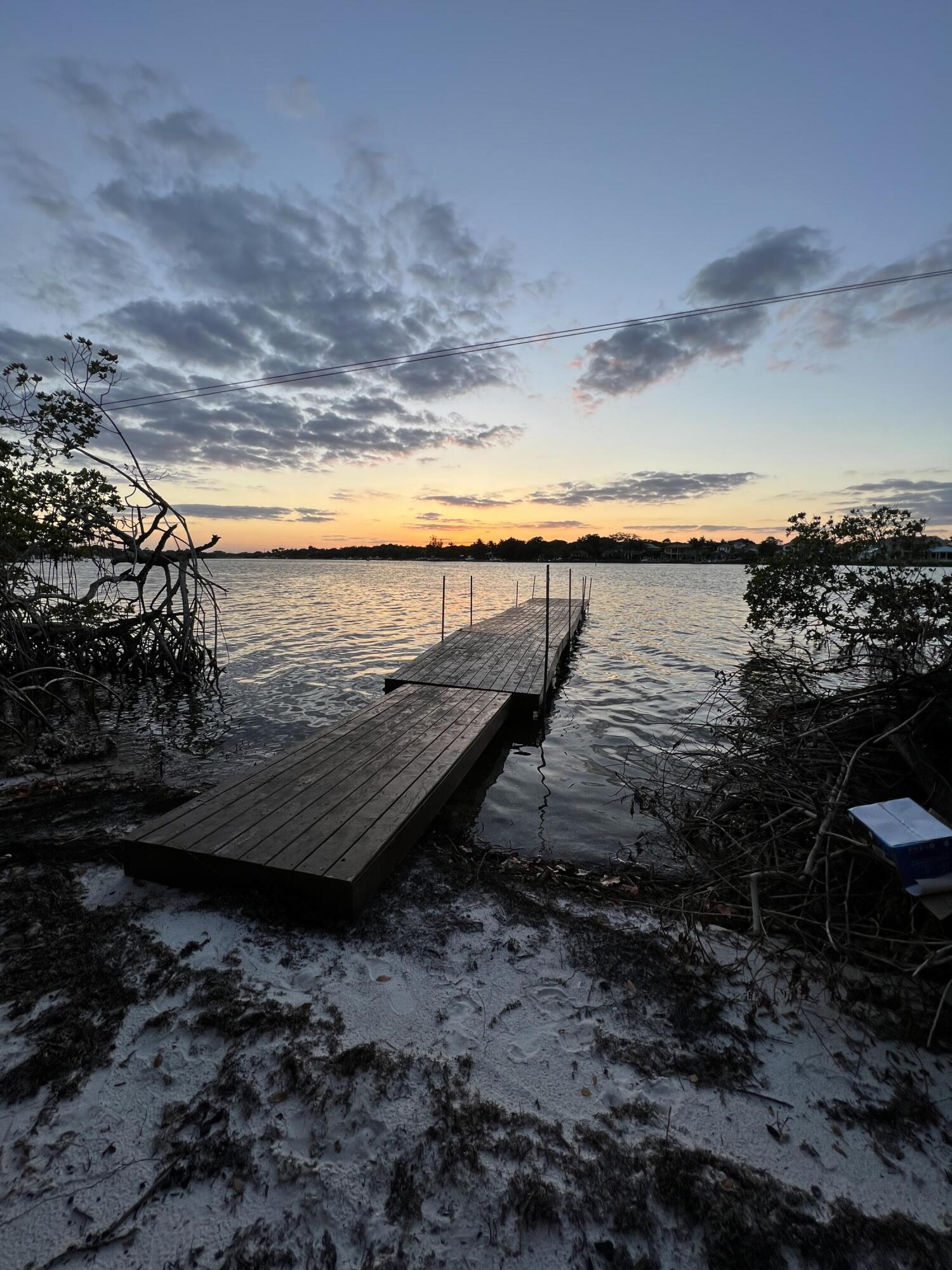 18200 49th Terrace North Jupiter, FL 33458 - Photo 2 of 17 a view of a ocean next to a yard