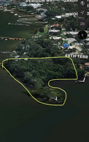 an aerial view of a residential houses with outdoor space