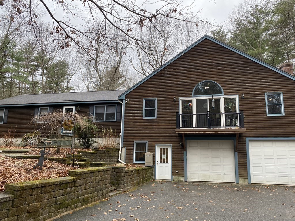 164 Pierce Road Townsend, MA 01469 - Photo 1 of 23 a front view of a house with garage