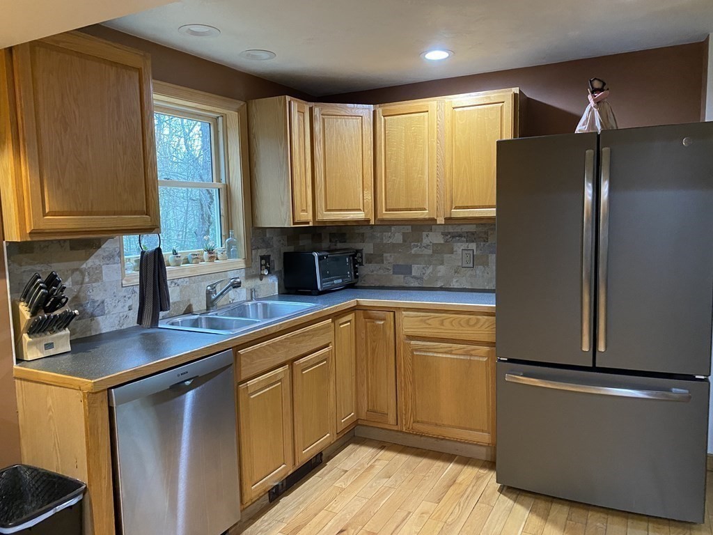 164 Pierce Road Townsend, MA 01469 - Photo 5 of 23 a kitchen with stainless steel appliances a refrigerator sink and cabinets