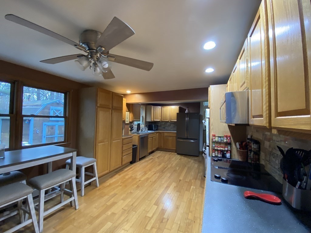 164 Pierce Road Townsend, MA 01469 - Photo 8 of 23 a living room with stainless steel appliances kitchen island granite countertop furniture and a chandelier