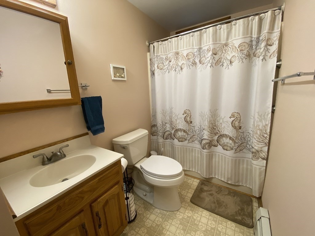 164 Pierce Road Townsend, MA 01469 - Photo 9 of 23 a bathroom with a sink and a mirror