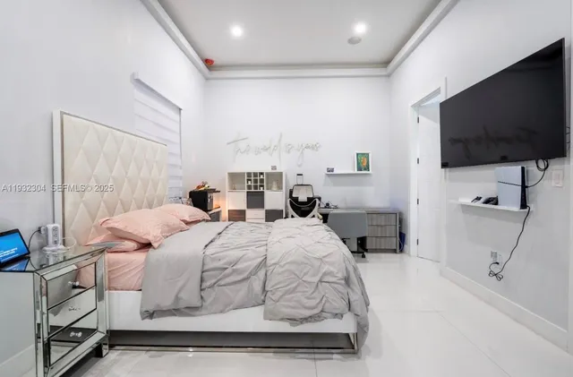 a bathroom with a granite countertop sink a mirror and a shower