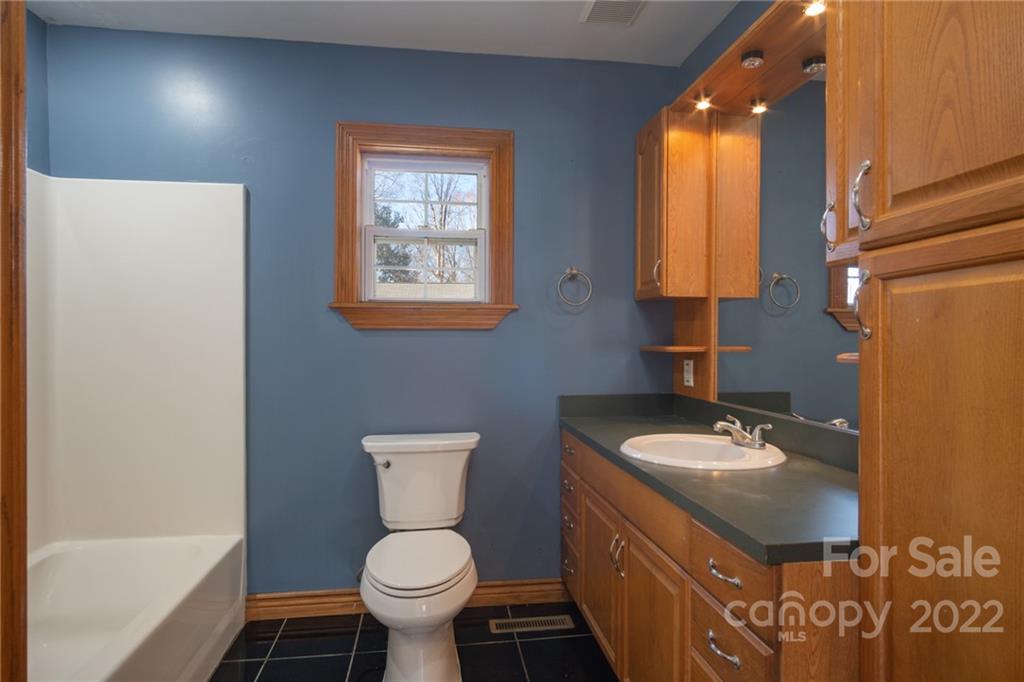 2501 Whitley Road Fort Mill, SC 29708 - Photo 15 of 46 a bathroom with a sink toilet and shower