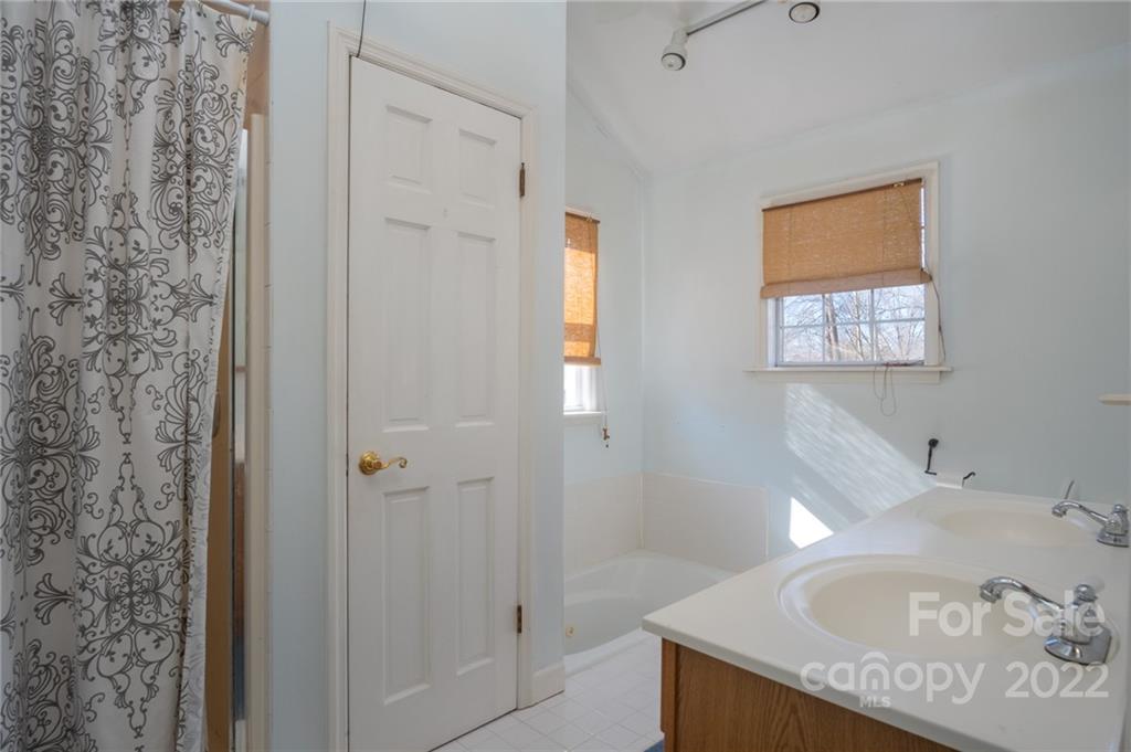 2501 Whitley Road Fort Mill, SC 29708 - Photo 21 of 46 a bathroom with a tub and a sink