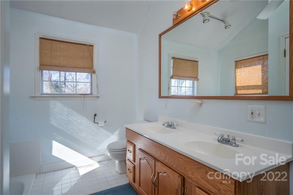 2501 Whitley Road Fort Mill, SC 29708 - Photo 22 of 46 a bathroom with a sink double vanity and a toilet