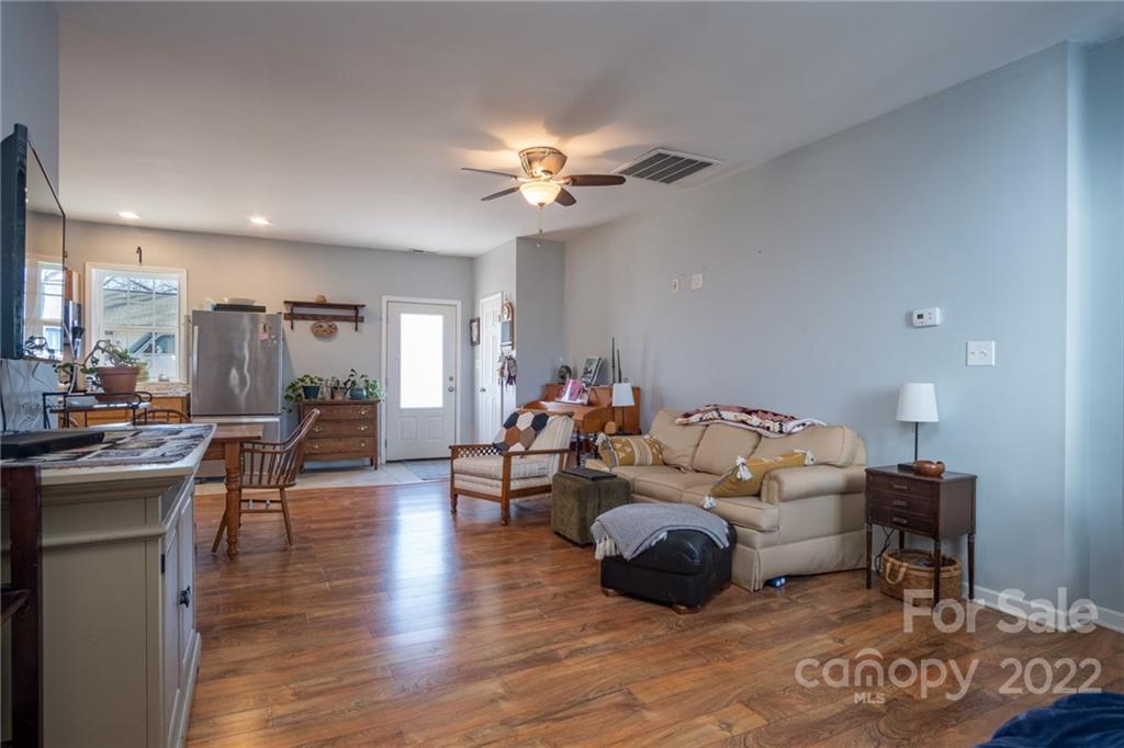 2501 Whitley Road Fort Mill, SC 29708 - Photo 32 of 46 a living room with furniture and a chandelier