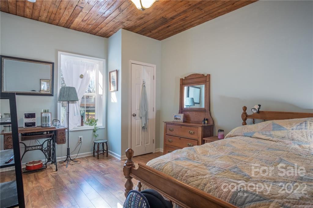 2501 Whitley Road Fort Mill, SC 29708 - Photo 33 of 46 a bedroom with a bed and wooden furniture