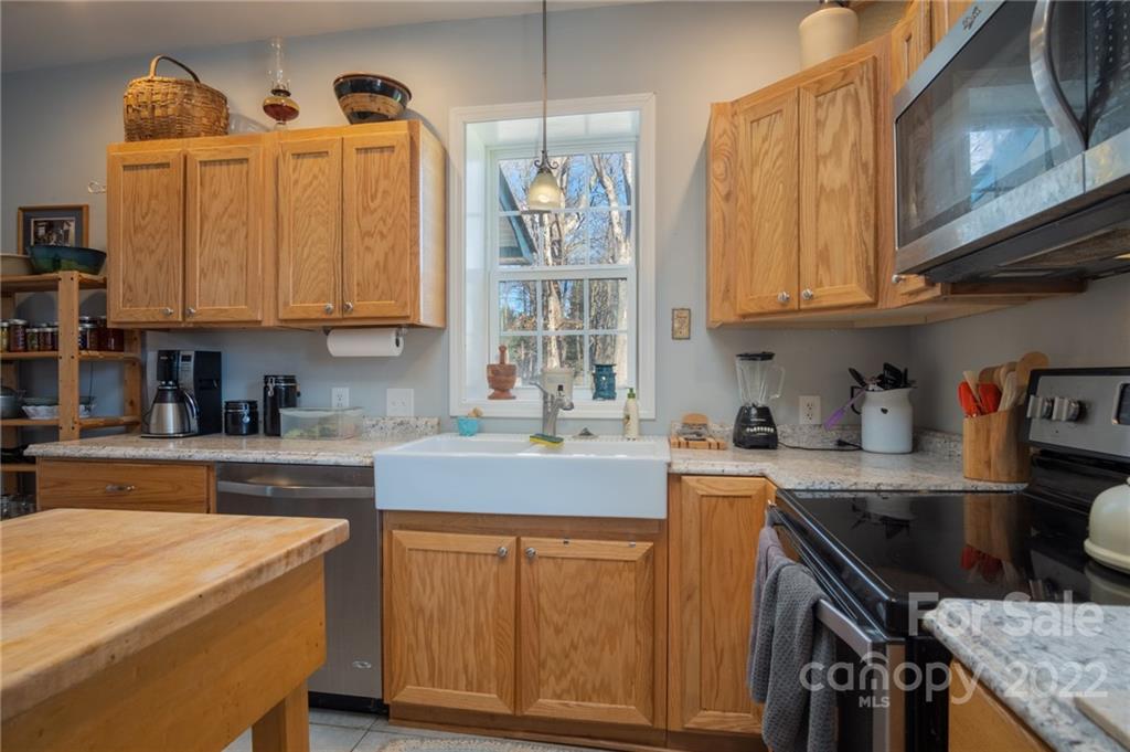 2501 Whitley Road Fort Mill, SC 29708 - Photo 37 of 46 a kitchen with stainless steel appliances granite countertop a sink stove and cabinets