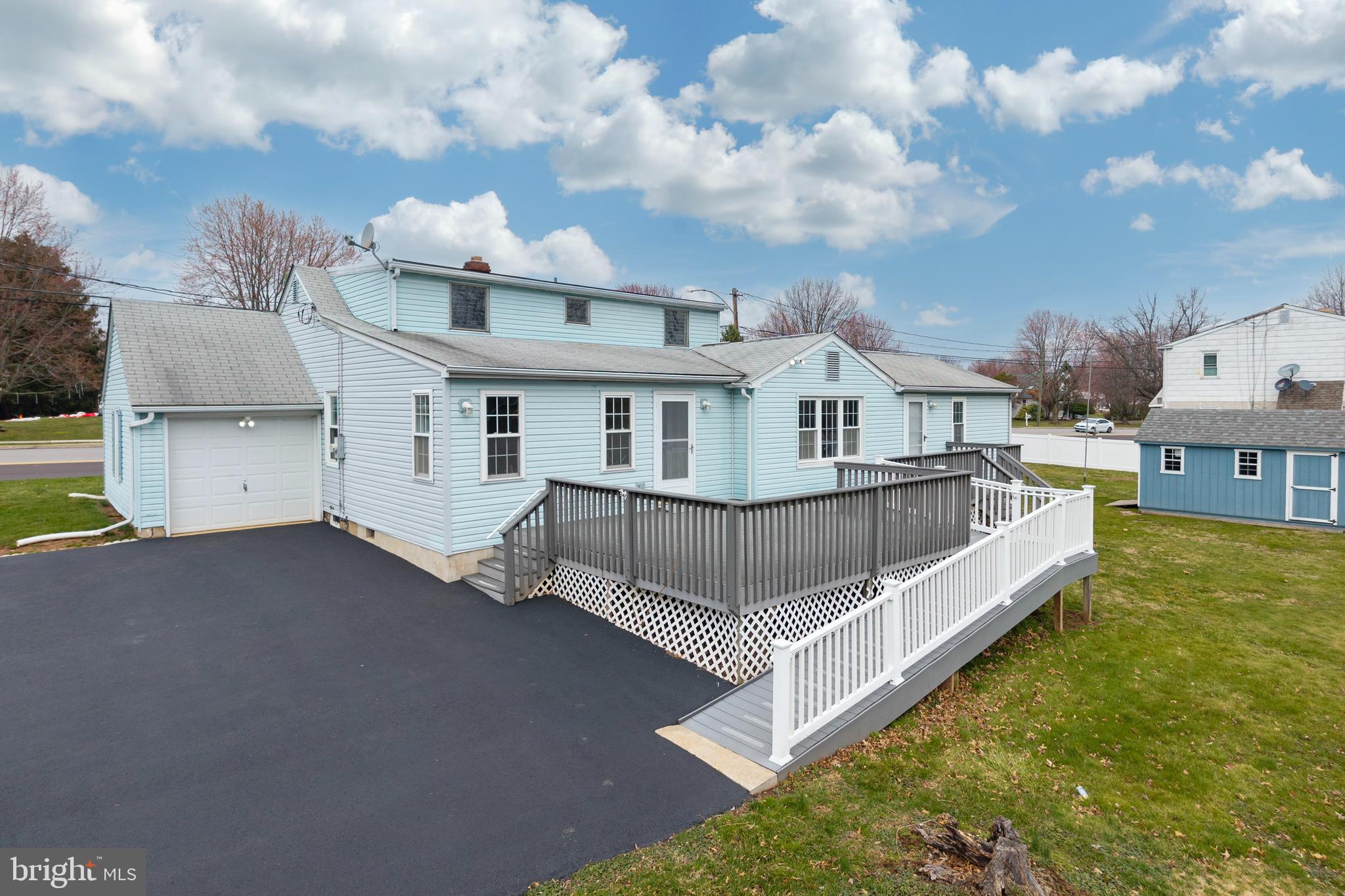 933 Forty Foot Road Hatfield, PA 19440 - Photo 2 of 28 a view of a house with a wooden deck and a yard