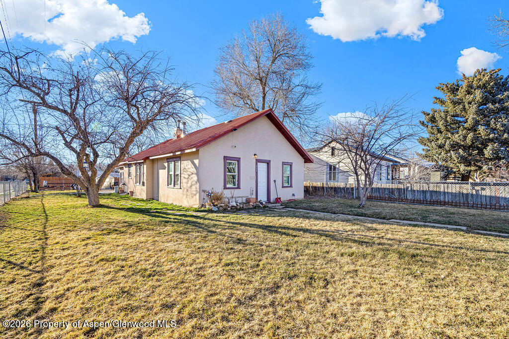 604 Tucker Street Craig, CO 81625 - Photo 1 of 35 a view of a house with a yard