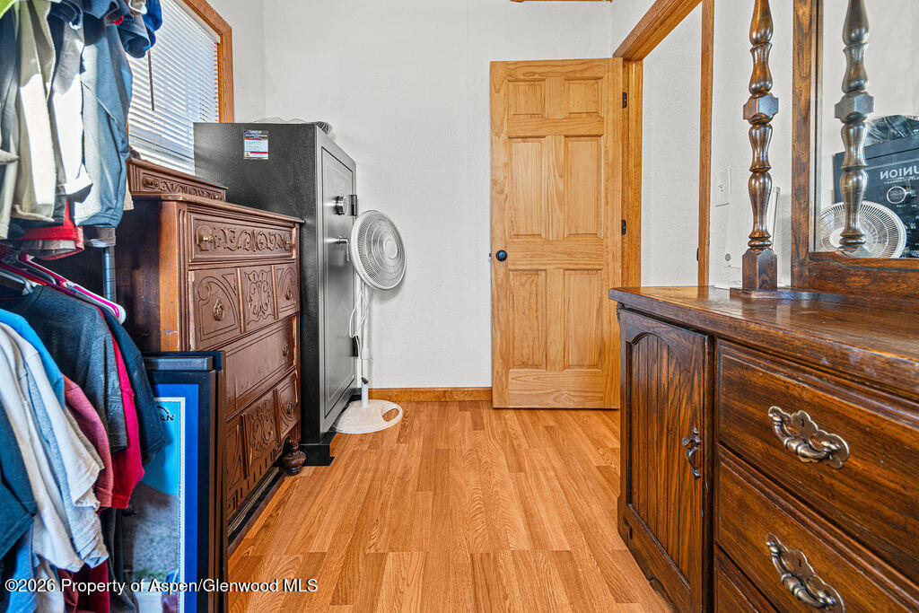 604 Tucker Street Craig, CO 81625 - Photo 19 of 35 a view of walk in closet with clothes and shoes