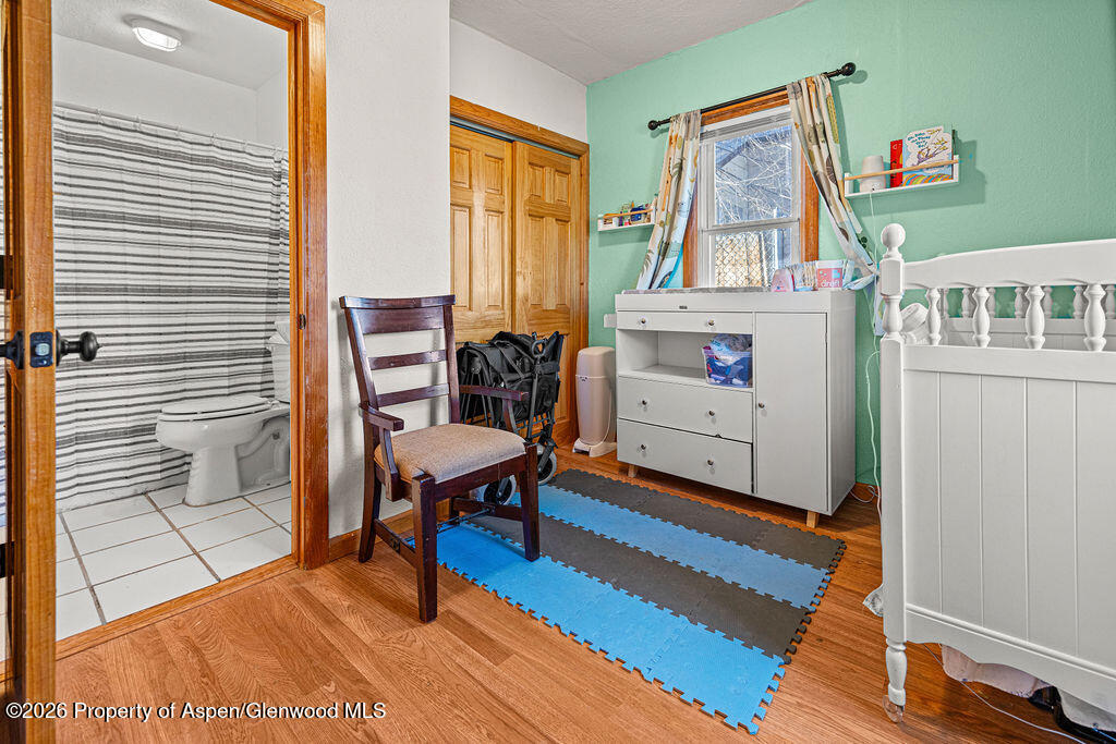604 Tucker Street Craig, CO 81625 - Photo 21 of 35 a living room with furniture a rug and a window