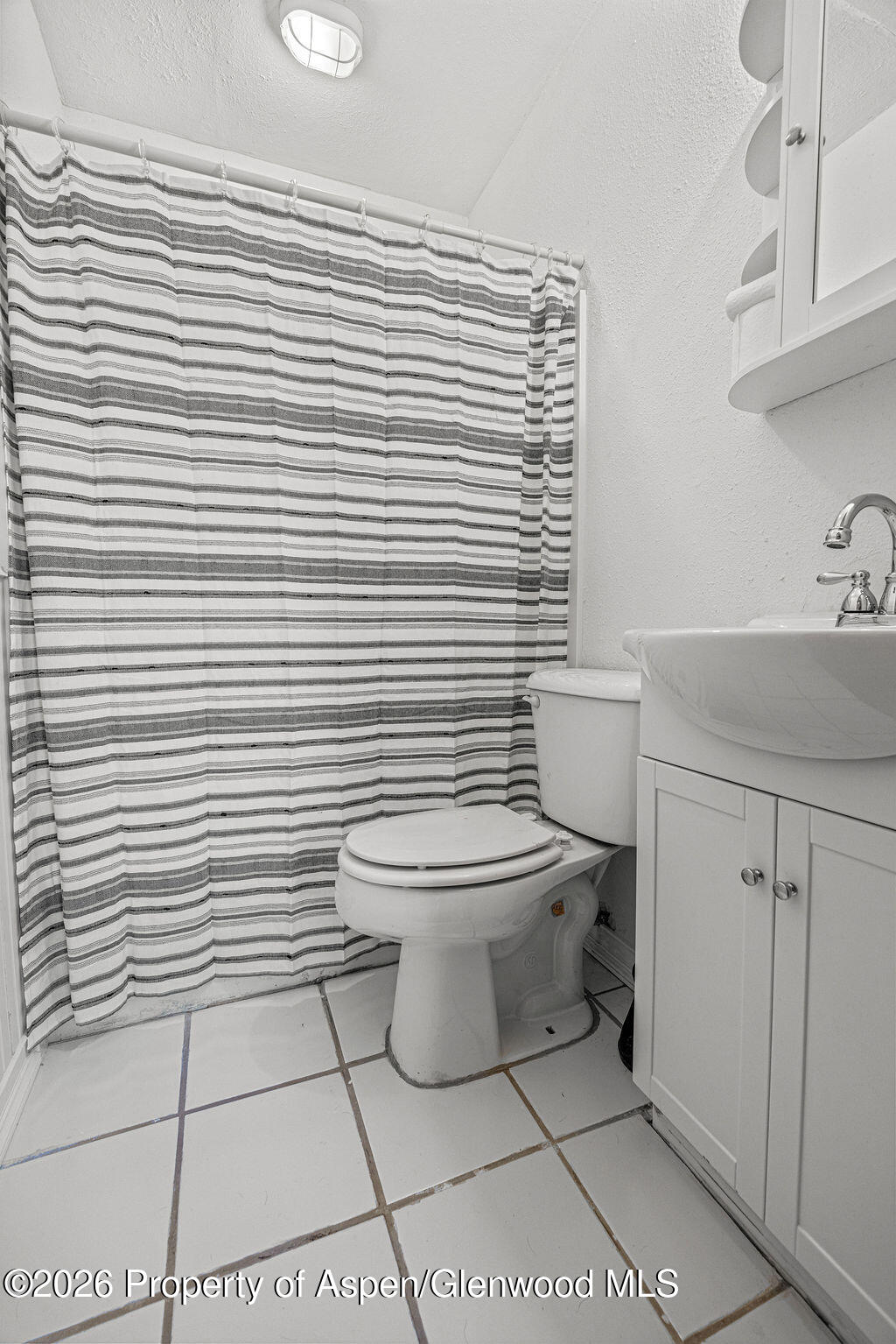 604 Tucker Street Craig, CO 81625 - Photo 23 of 35 a bathroom with a toilet and a sink
