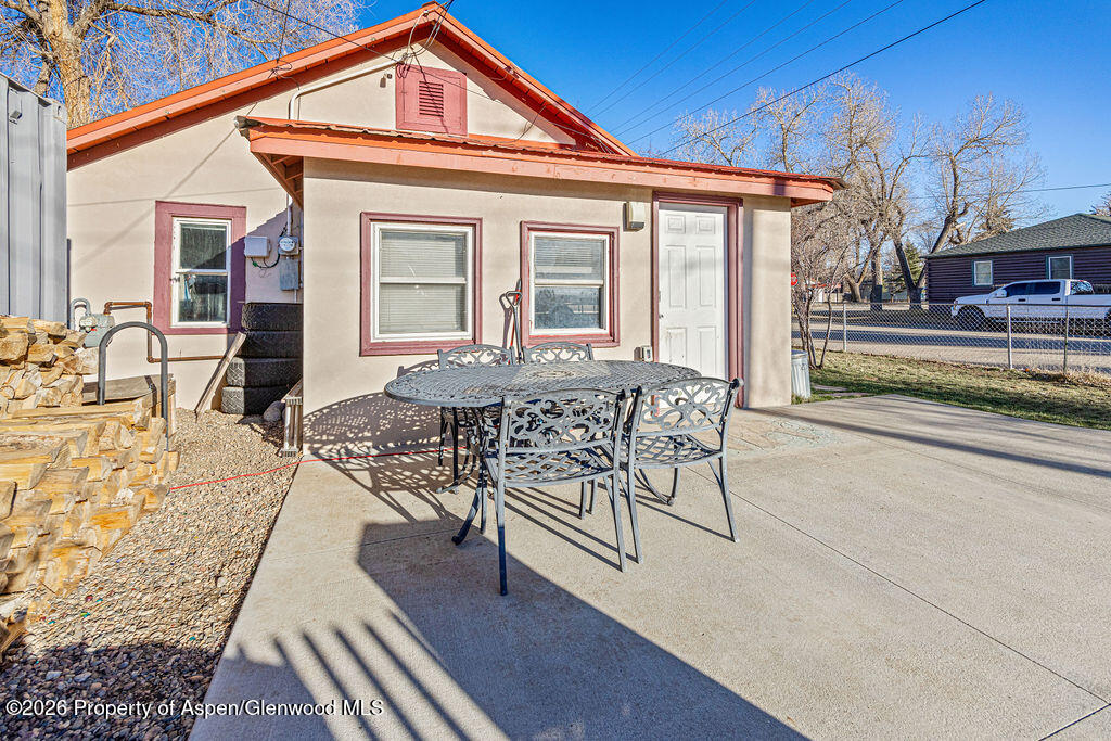 604 Tucker Street Craig, CO 81625 - Photo 25 of 35 a view of a house with backyard porch and sitting area