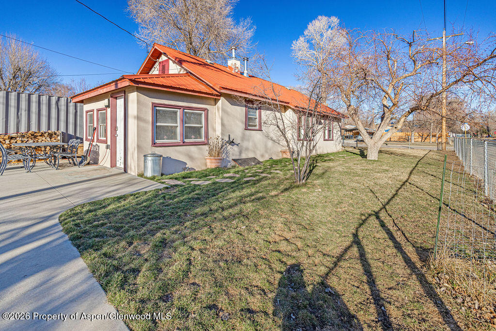604 Tucker Street Craig, CO 81625 - Photo 28 of 35 a front view of a house with a yard