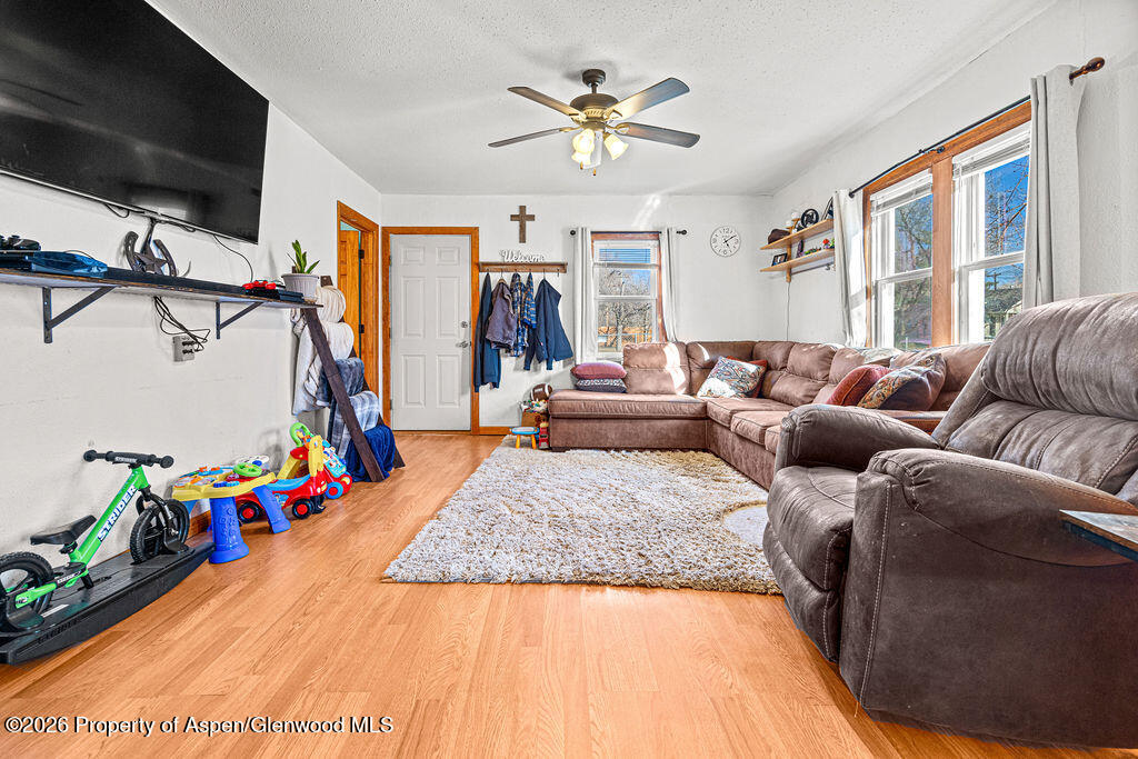 604 Tucker Street Craig, CO 81625 - Photo 6 of 35 a living room with furniture and a flat screen tv