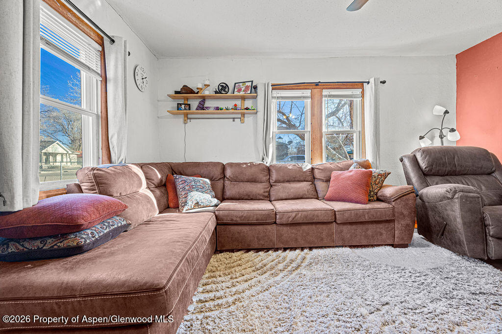 604 Tucker Street Craig, CO 81625 - Photo 7 of 35 a living room with furniture and a window