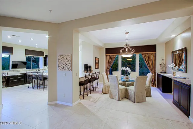 a living room with furniture a flat screen tv and a large window