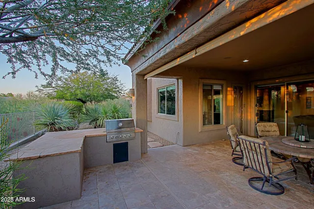 a outdoor space with patio furniture and garden