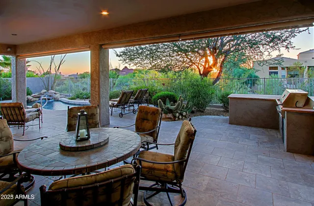 a view of a patio filled with furniture