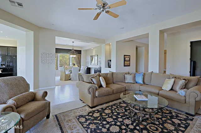 a living room with furniture and a rug