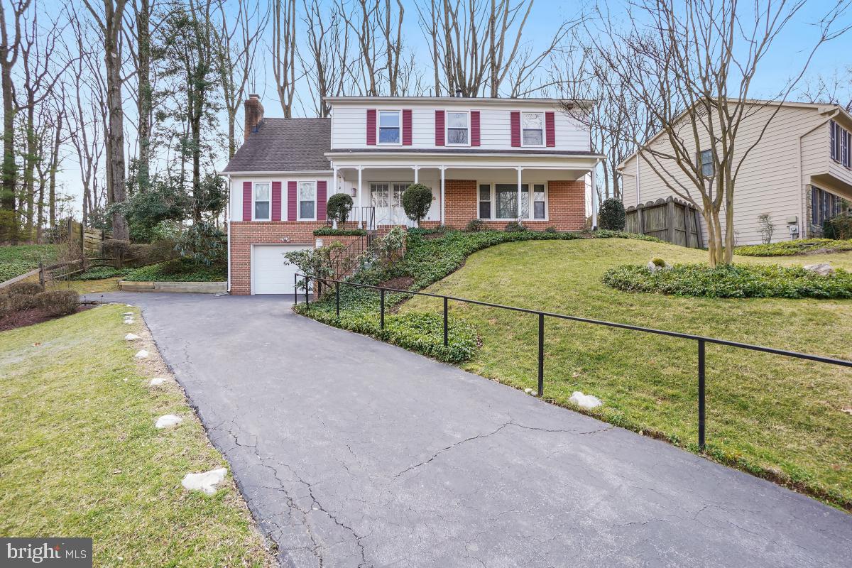 7802 Ivymount Terrace Potomac, MD 20854 - Photo 1 of 51 a view of a house with a small yard and large trees