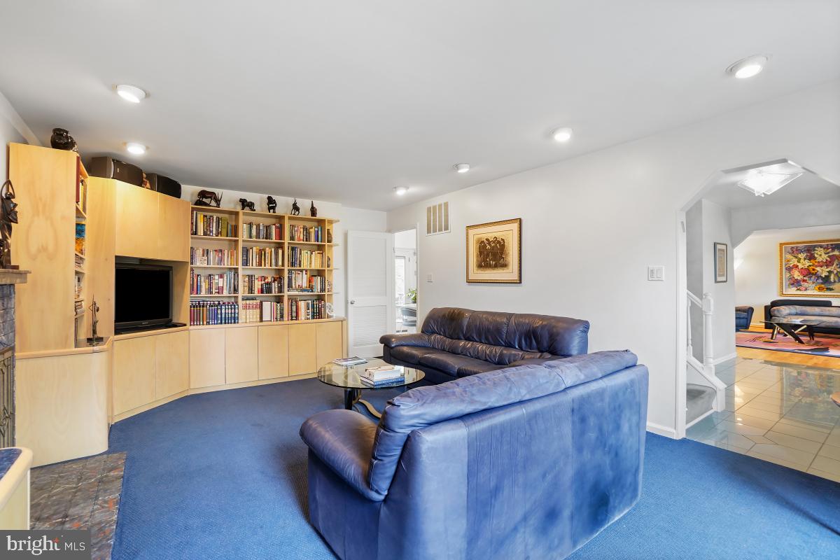7802 Ivymount Terrace Potomac, MD 20854 - Photo 11 of 51 a living room with furniture and a flat screen tv