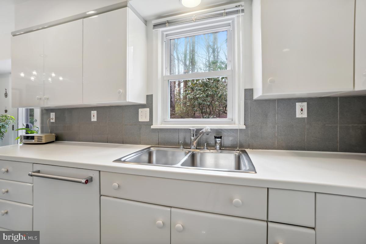 7802 Ivymount Terrace Potomac, MD 20854 - Photo 15 of 51 a kitchen with a sink and a window