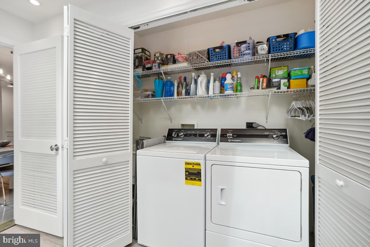 7802 Ivymount Terrace Potomac, MD 20854 - Photo 17 of 51 a utility room with dryer and washer