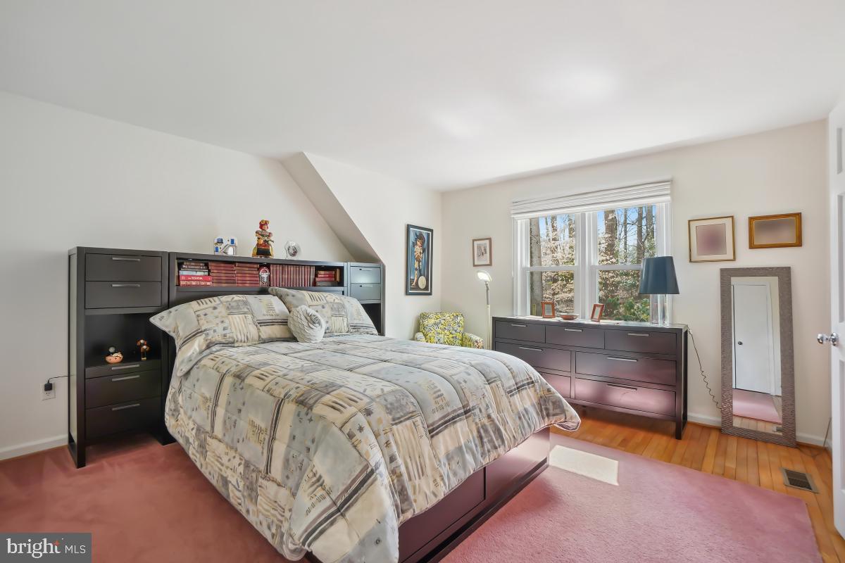 7802 Ivymount Terrace Potomac, MD 20854 - Photo 19 of 51 a bedroom with a bed and a dresser