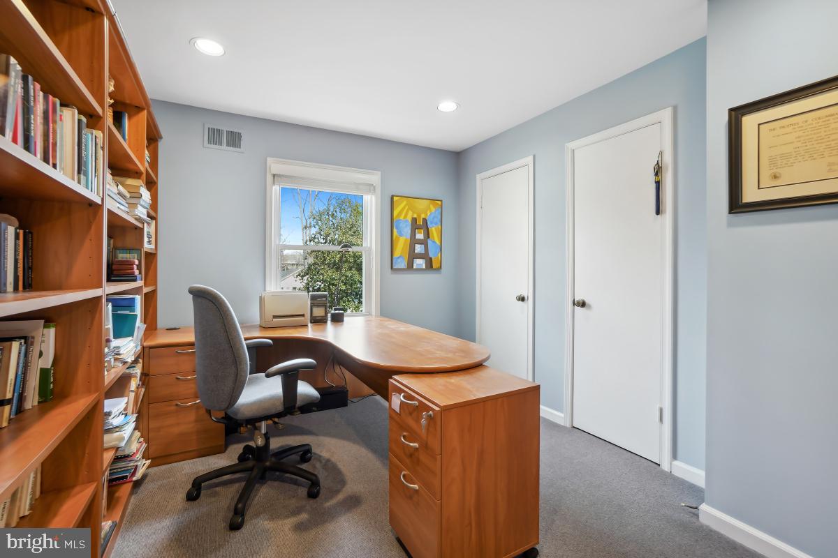 7802 Ivymount Terrace Potomac, MD 20854 - Photo 21 of 51 a view of a workspace with furniture and a workspace