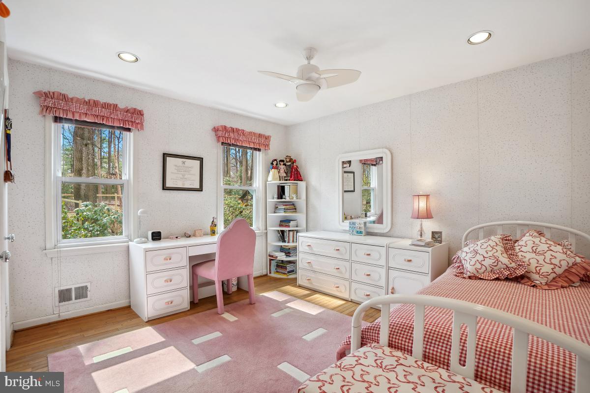 7802 Ivymount Terrace Potomac, MD 20854 - Photo 23 of 51 a bedroom with a bed and a dresser