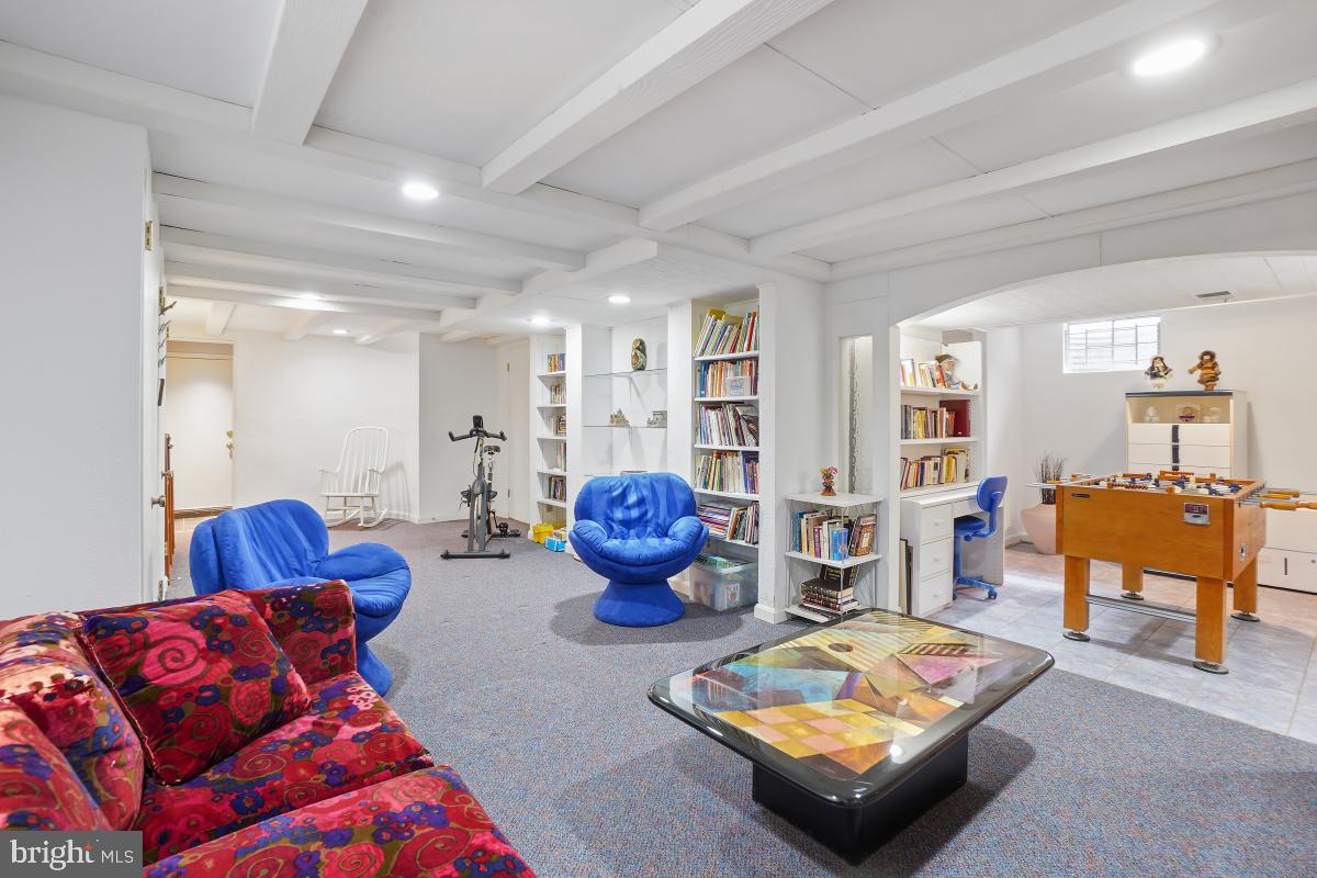 7802 Ivymount Terrace Potomac, MD 20854 - Photo 27 of 51 a living room with furniture and a table