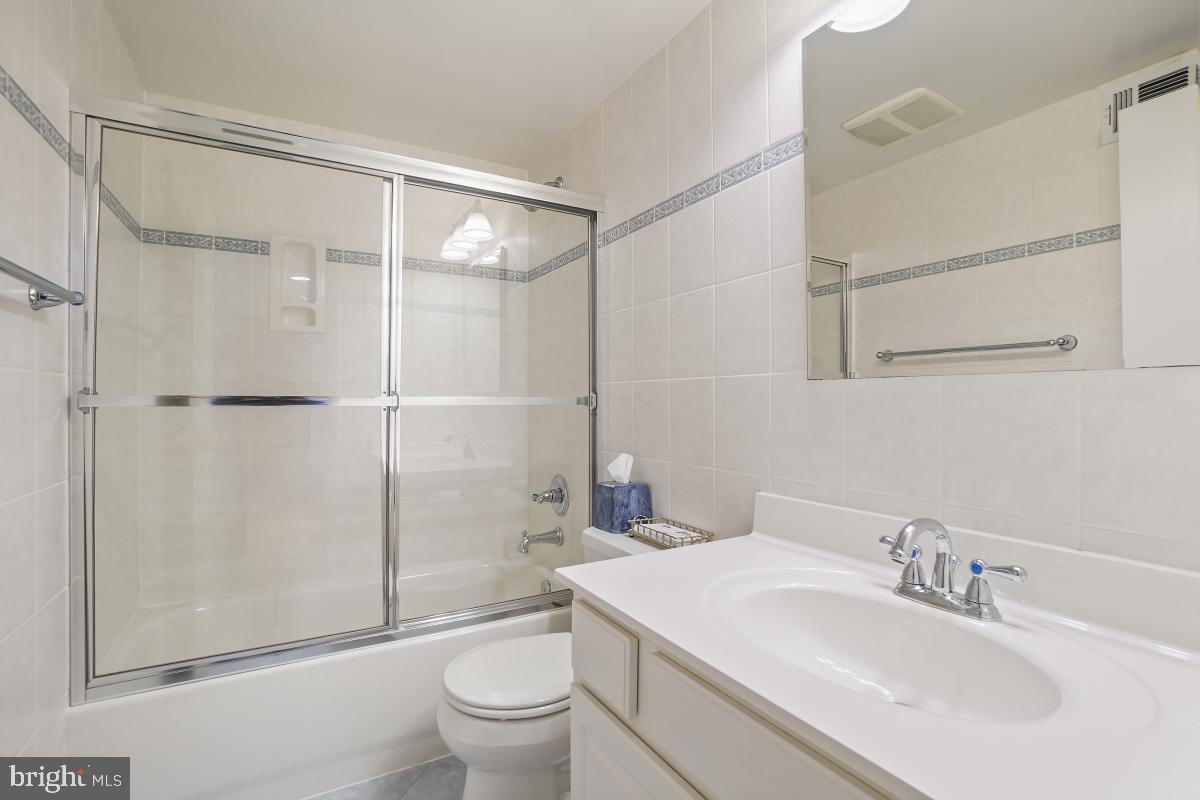 7802 Ivymount Terrace Potomac, MD 20854 - Photo 28 of 51 a bathroom with a sink toilet and shower