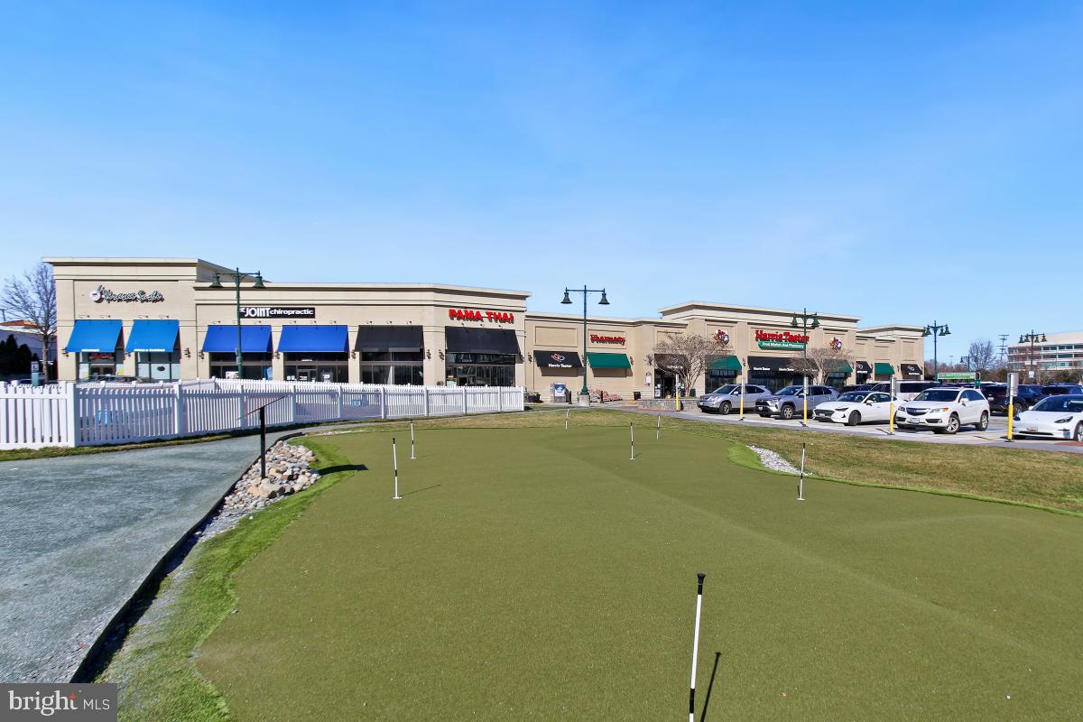 7802 Ivymount Terrace Potomac, MD 20854 - Photo 33 of 51 a view of a swimming pool in front of house