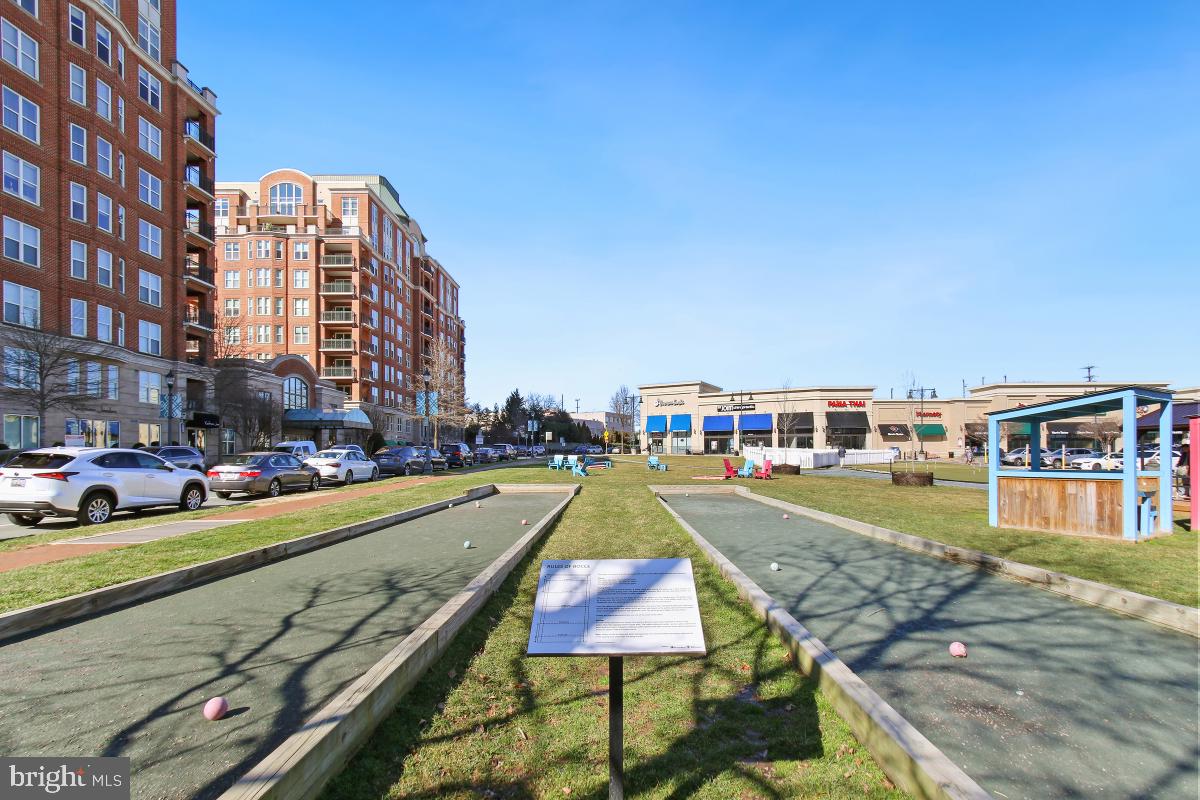 7802 Ivymount Terrace Potomac, MD 20854 - Photo 34 of 51 a view of an buildings with cars parked