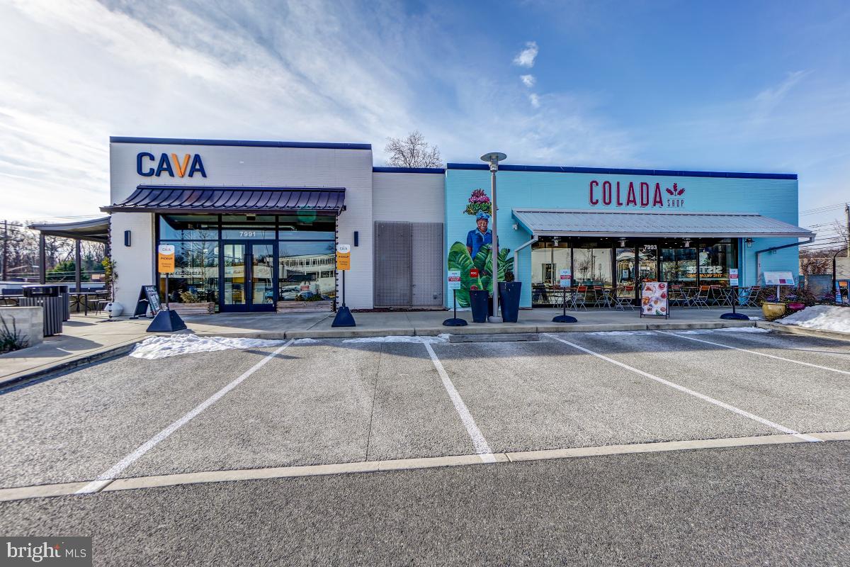 7802 Ivymount Terrace Potomac, MD 20854 - Photo 35 of 51 a store with outdoor seating area and car parked
