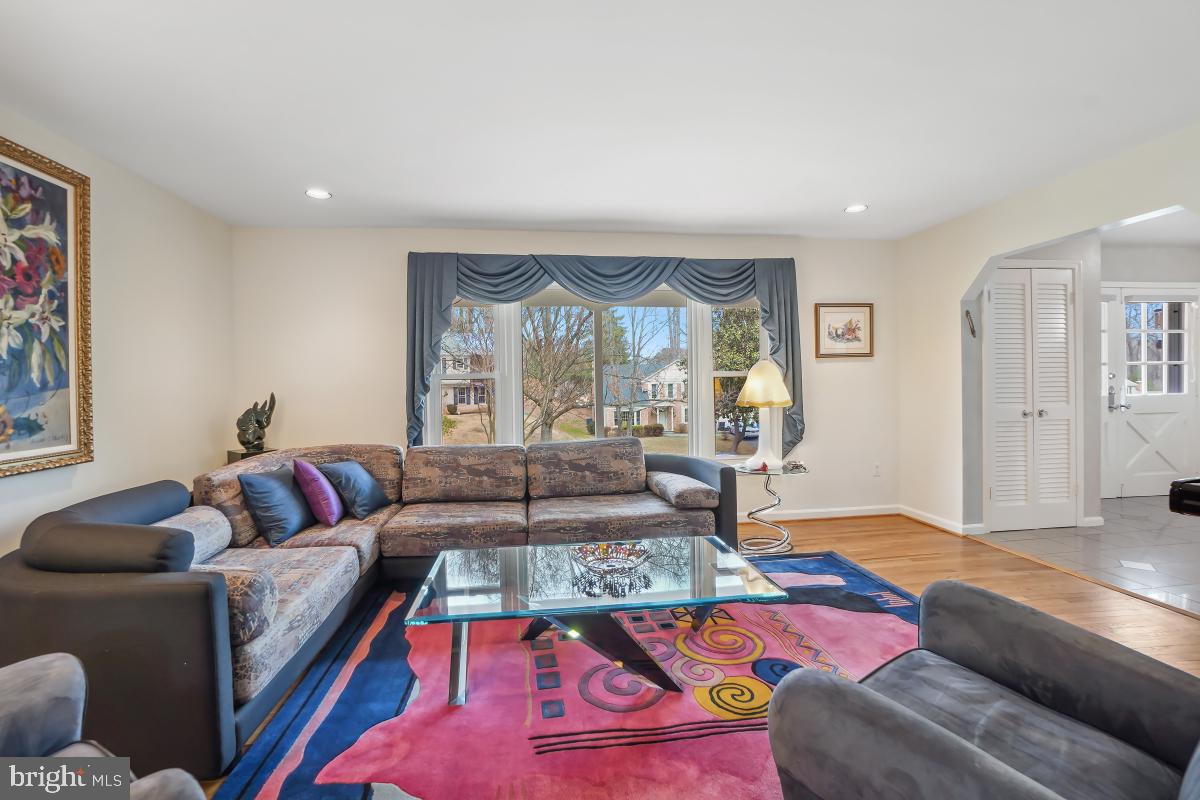 7802 Ivymount Terrace Potomac, MD 20854 - Photo 6 of 51 a living room with furniture and a large window