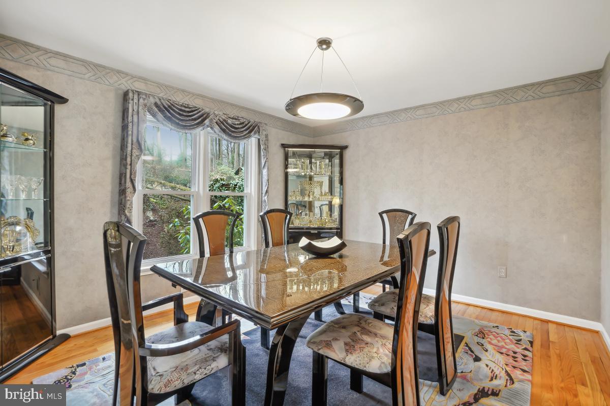 7802 Ivymount Terrace Potomac, MD 20854 - Photo 8 of 51 a view of a dining room with furniture window and outside view