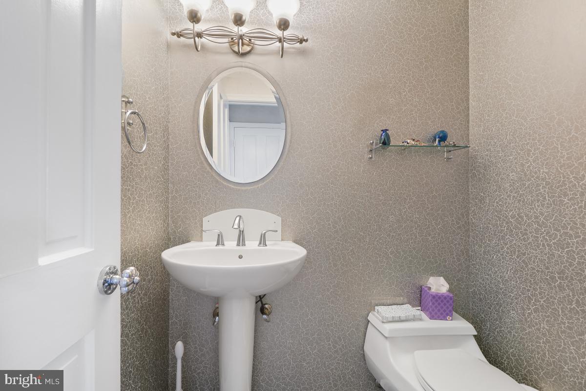 7802 Ivymount Terrace Potomac, MD 20854 - Photo 10 of 51 a bathroom with a sink toilet and a mirror